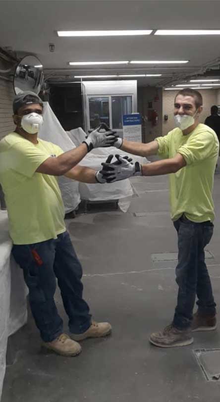 Construction worker wearing Tuff Hands™ Safety Pro Gray Gloves