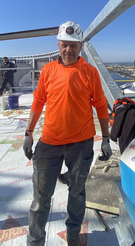 Construction worker wearing Tuff Hands™ Safety Pro Gray Gloves