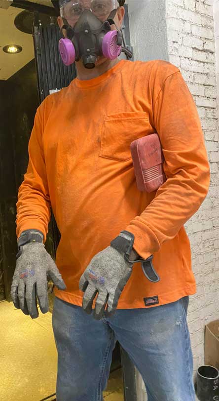 Construction worker wearing Tuff Hands™ Safety Pro Gray Gloves