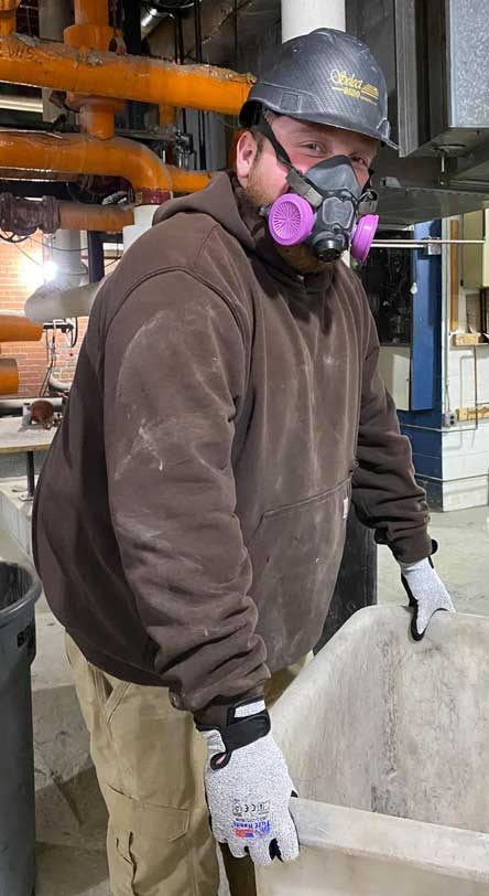 Construction worker wearing Tuff Hands™ Safety Pro Gray Gloves