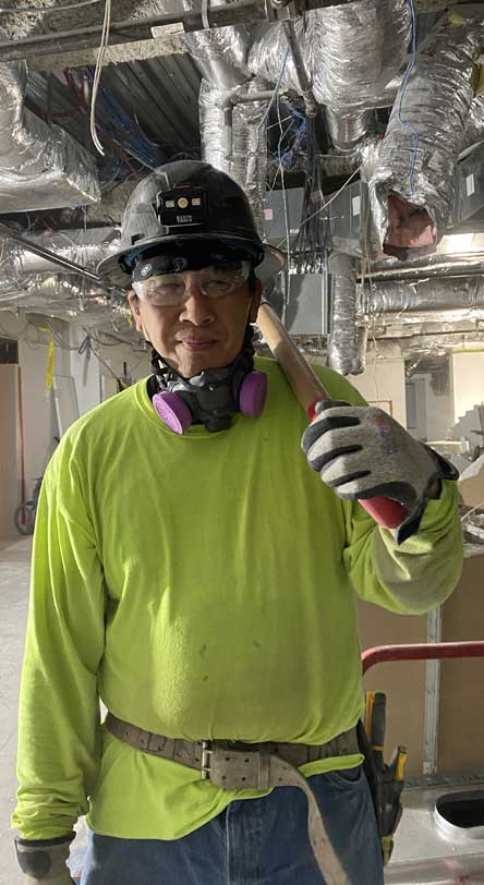 Construction worker wearing Tuff Hands™ Safety Pro Gray Gloves