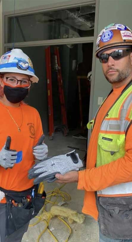 Construction worker wearing Tuff Hands™ Safety Pro Gray Gloves